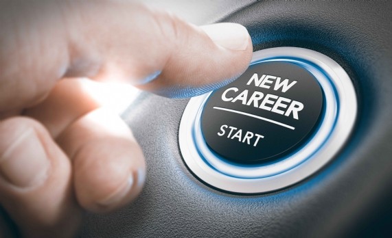 Finger pressing a new career start button. Concept of occupational or profession
